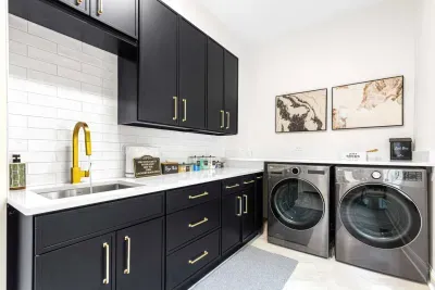 Laundry room with brand new washer and dryer.  Includes detergent.