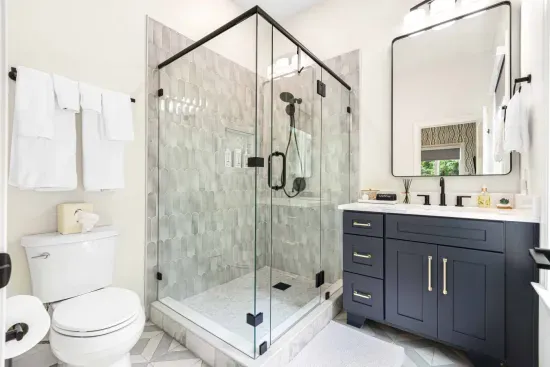 Ensuite bathroom connected to the secondary bedroom, with large shower.