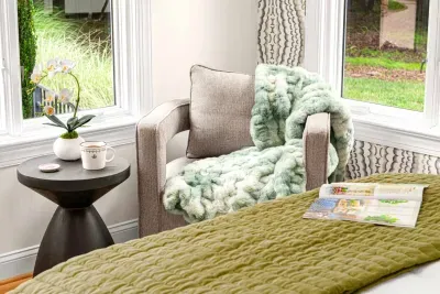 Secondary bedroom with Queen size bed and views to the beautiful back yard.  Seating area to enjoy your morning coffee.