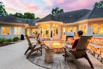 Enjoy our expansive backyard with firepit, hot tub, outdoor dining, cornhole, and more.