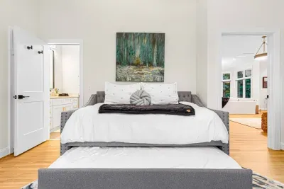 Another bedroom with a twin-sized daybed and twin-sized trundle bed underneath.