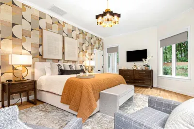 Large primary bedroom with King size bed and plenty of extra seating.
