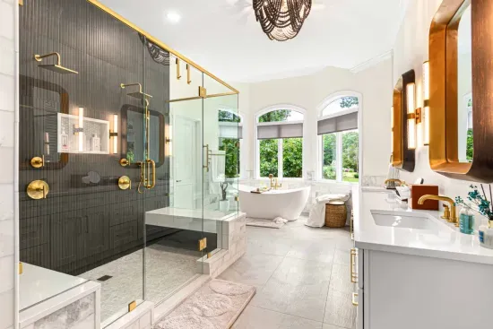 Huge primary bathroom with dual shower, double vanities, and gorgeous soaking tub.