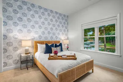 Another large bedroom is located on the lower level with a queen bed, walk-in closet, and ensuite bathroom.