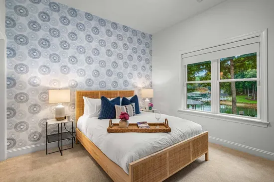 Another large bedroom is located on the lower level with a queen bed, walk-in closet, and ensuite bathroom.
