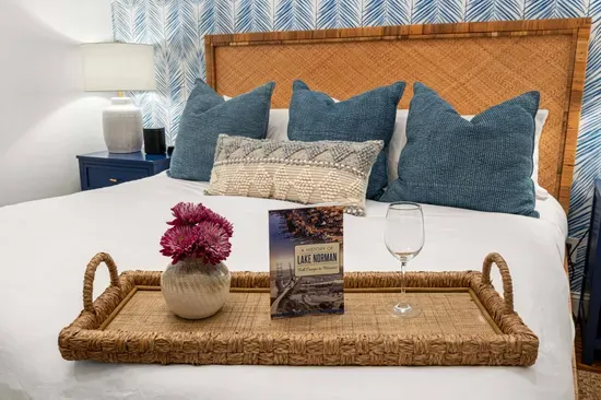 Also on the main floor is a beautiful secondary bedroom with a king bed and a television.  Guests in this room will share the primary bathroom.