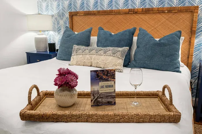 Also on the main floor is a beautiful secondary bedroom with a king bed and a television.  Guests in this room will share the primary bathroom.