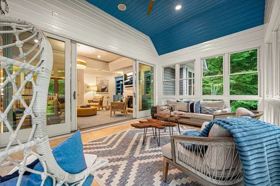 Relax in our sunroom and take in the beautiful view of the lake and the property.