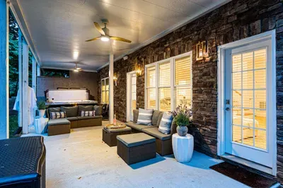 Walking outside from the lower level leads to a seating area and our hot tub, perfect for lounging around in the shade.