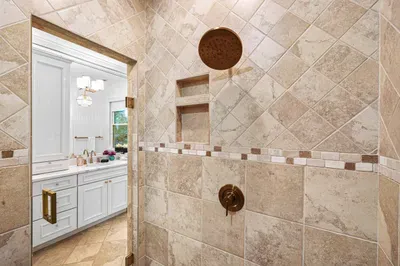The primary bedroom also has a very large ensuite bathroom with dual vanities and huge walk-in shower.