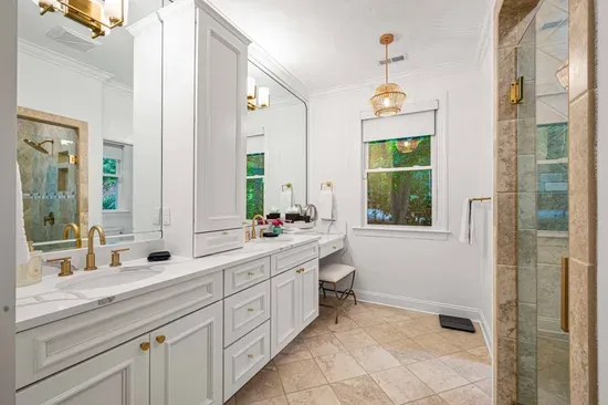The primary bedroom also has a very large ensuite bathroom with dual vanities and huge walk-in shower.