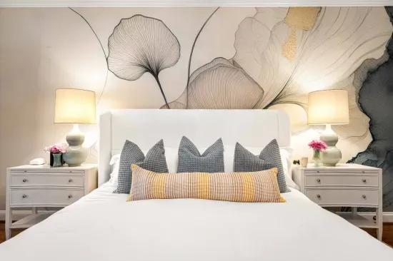 Our primary bedroom is on the main floor and features a king bed, TV, and sitting area.