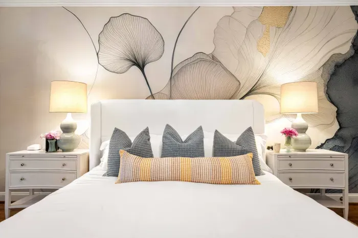 Our primary bedroom is on the main floor and features a king bed, TV, and sitting area.