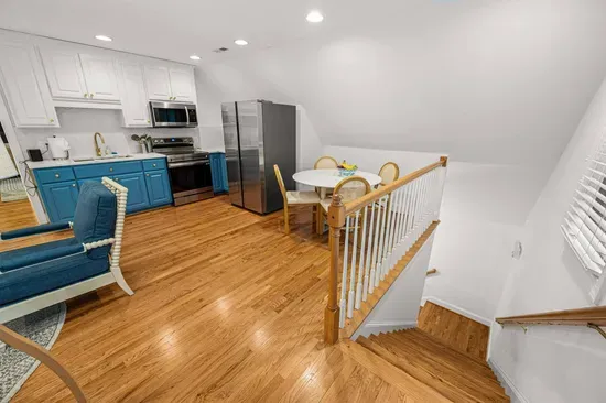 In the garage there is an entrance to an upstairs apartment that sits over the garage area.