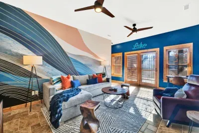 Enjoy the main room downstairs with an entrance straight to the lake.  Features Article sofa bed, 55" LCD TV, and yoga mats.