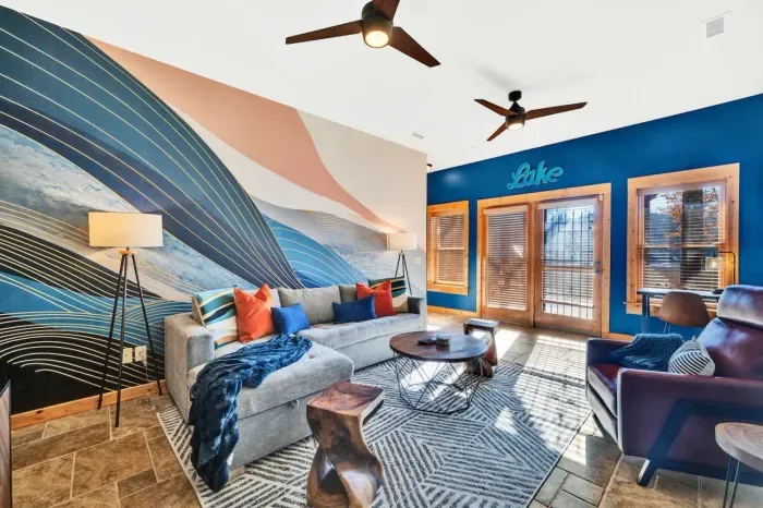 Enjoy the main room downstairs with an entrance straight to the lake.  Features Article sofa bed, 55" LCD TV, and yoga mats.