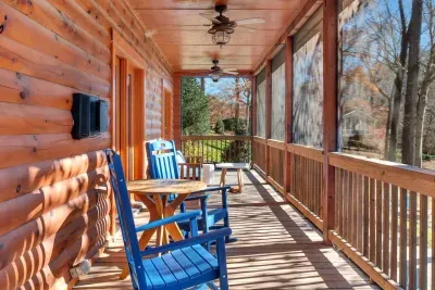 Upstairs porch with rocking chairs for hot coffee with a full on view of the lake.
