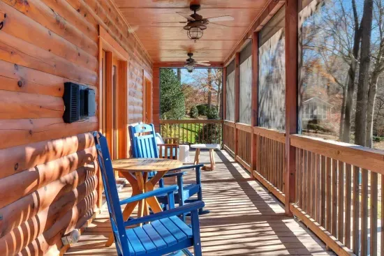 Upstairs porch with rocking chairs for hot coffee with a full on view of the lake.