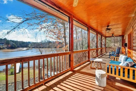 Grab a cup of freshly brewed coffee and relax on our upstairs  porch with lake view, rocking chairs and daybed that is PERFECT for relaxing naps during a rainy day