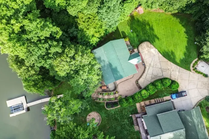 Overhead view of the property with dock and cabin.