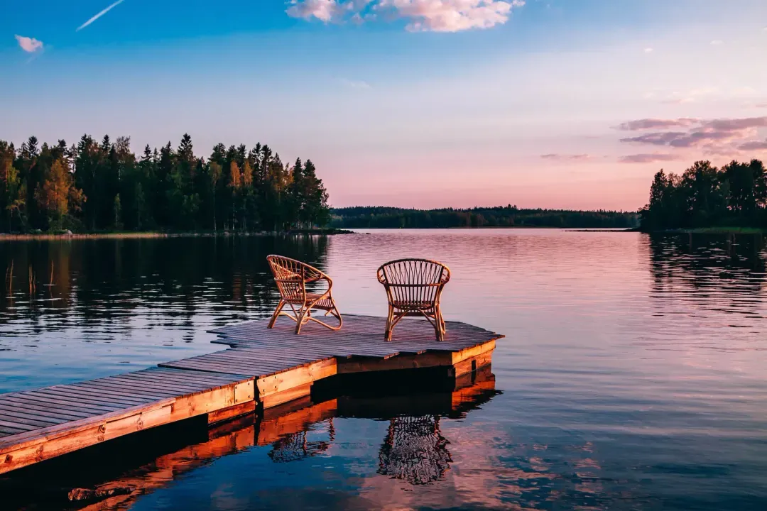 two-wooden-chairs-on-a-wood-pier-overlooking-a-lak-2026-03-24-23-53-00-utc