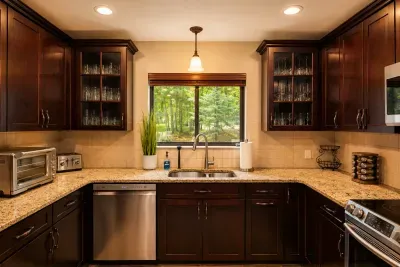 Rich cabinetry, granite
counters, and a leafy view
make cooking a pleasure.