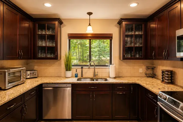 Rich cabinetry, granite
counters, and a leafy view
make cooking a pleasure.