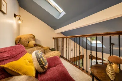 Sink into the loft sofa for
games, reading, or
cheering on the fun below.