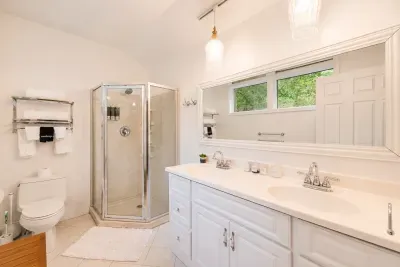 A roomy double vanity and
glass shower make the
morning routine a breeze.