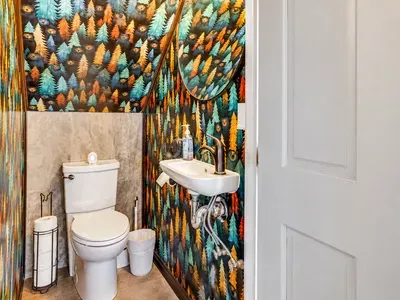 Colourful walls add a playful spark to this half bath.