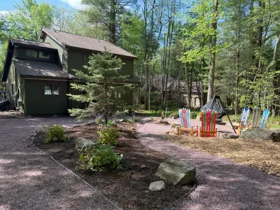 Front of home with amazing fire cauldron - perfect for making smores.