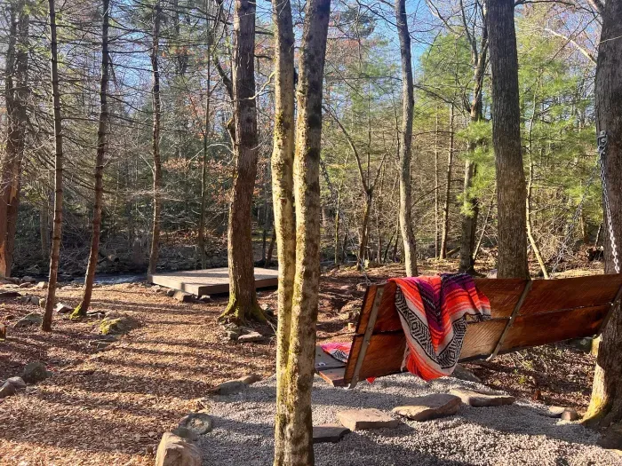 Swing bench overlooking the creek — perfect morning coffee spot