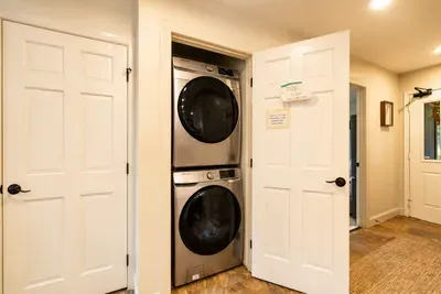 Pack light with a stacked washer and dryer ready for easy guest use.