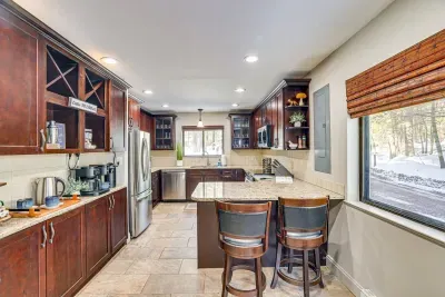 Fully equipped chef’s kitchen featuring stainless steel appliances and ample space for cooking and entertaining.