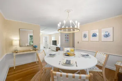 Don't let a little rain dampen your spirits! Our large dining table is the perfect spot for endless card game tournaments or delicious family meals. Make lasting memories, rain or shine!