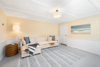 Airy coastal lounge with comfy chaise sofa and a spacious, light-filled vibe.