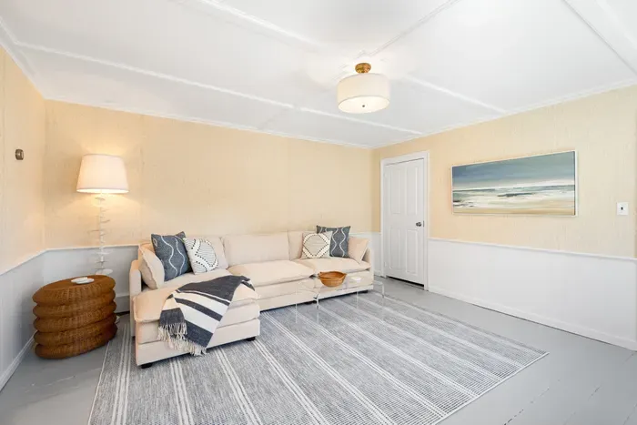 Airy coastal lounge with comfy chaise sofa and a spacious, light-filled vibe.