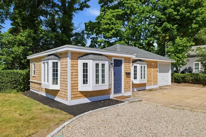 Charming shingle cottage with private drive, bay windows, and great curb appeal