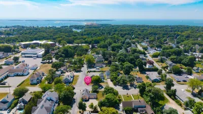 Aerial view in a leafy neighborhood near the water