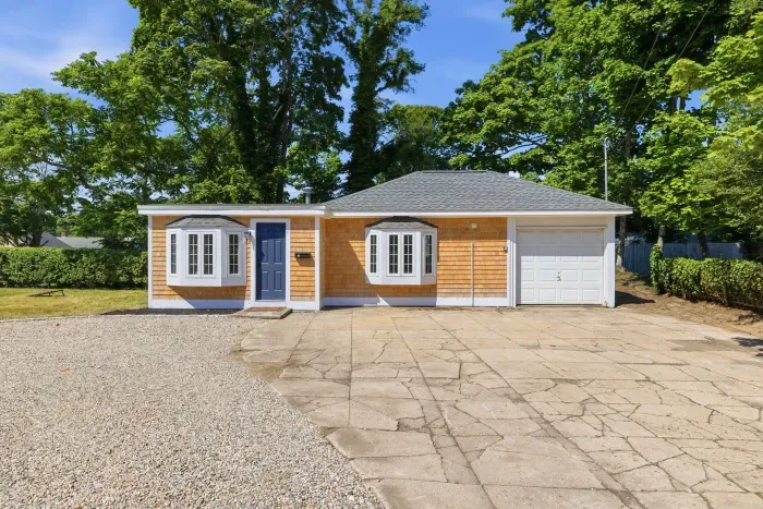 Charming single-story home with spacious driveway and peaceful setting