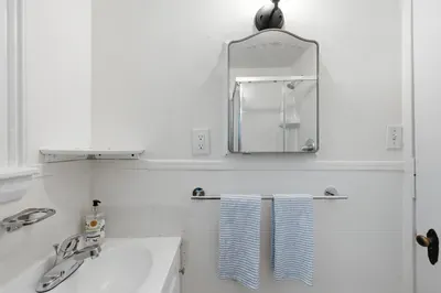 Clean bathroom with fresh towels and simple modern touches