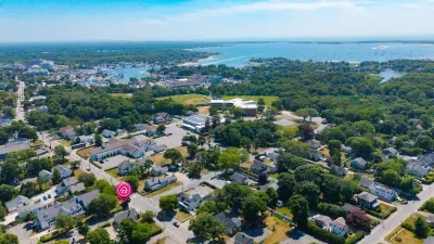 Aerial view of a charming coastal neighborhood near the water