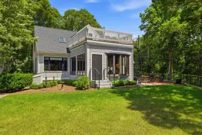 Private wooded retreat with lawn, patio, and rooftop deck seating