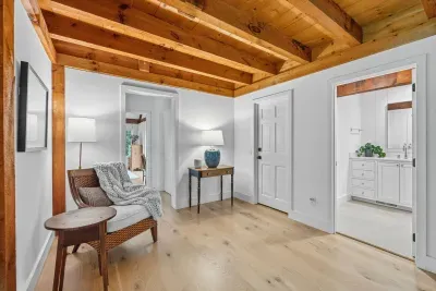 Bright retreat with exposed wood beams and a cozy sitting nook