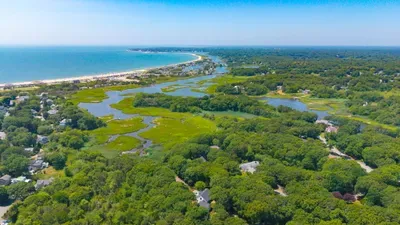 Scenic coastal escape near the beach, marshes, and lush greenery