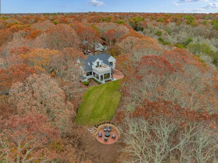 Private woodland retreat with spacious lawn and cozy fire pit area