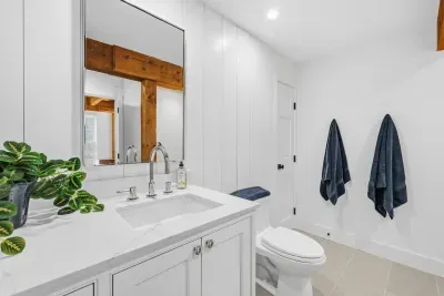 Bright modern bathroom with sleek finishes and warm rustic accents