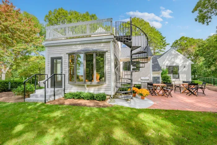 Spiral stairs, rooftop deck, and a sunny private patio retreat