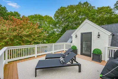 Private treetop deck with lounge chairs for sunny, peaceful outdoor relaxation