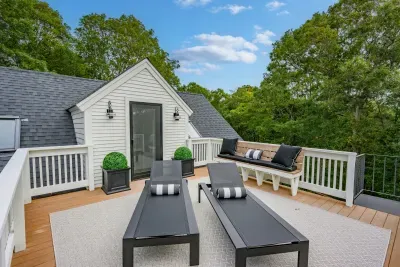 Private rooftop deck with stylish seating and serene treetop views